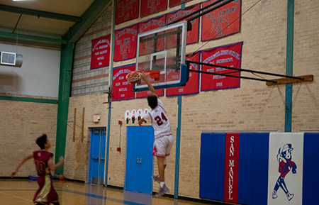 Caleb Quintero '20 slam dunks the basket. Picture: Aime Diaz '22