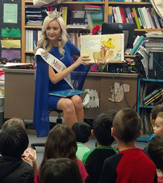 Pageant winner reads to students